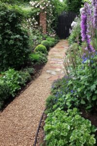 line pathways with gravel for a low maintenance cottage look